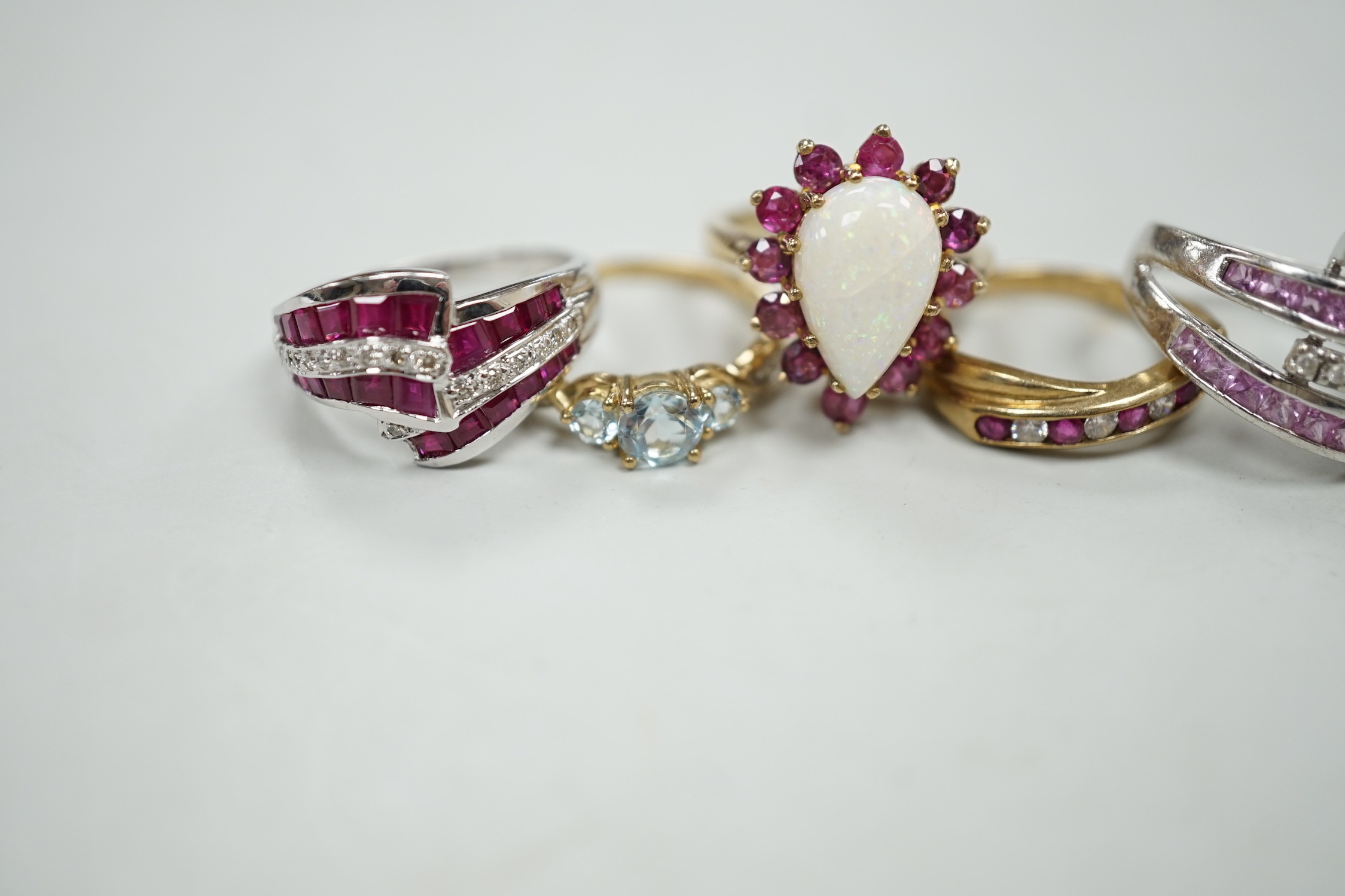 Five assorted modern 9ct gold and gem set dress rings, including ruby and diamond chip, gross weight 16.8 grams.
